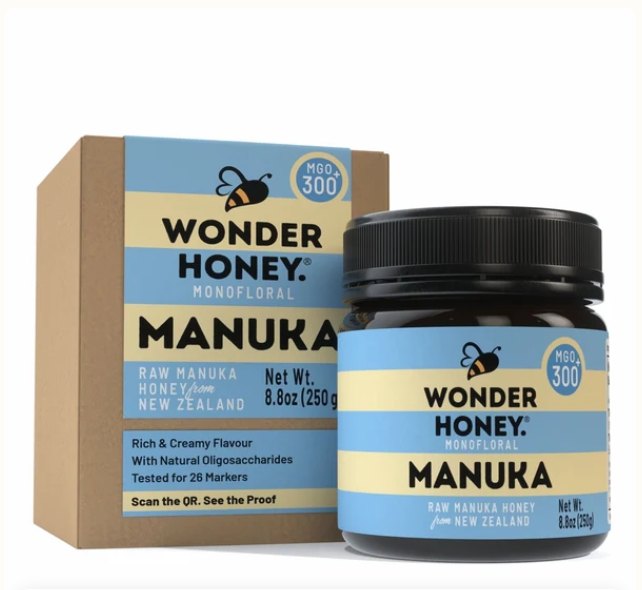 Wonder Honey mānuka honey jar and box, in the brand’s blue and cream packaging